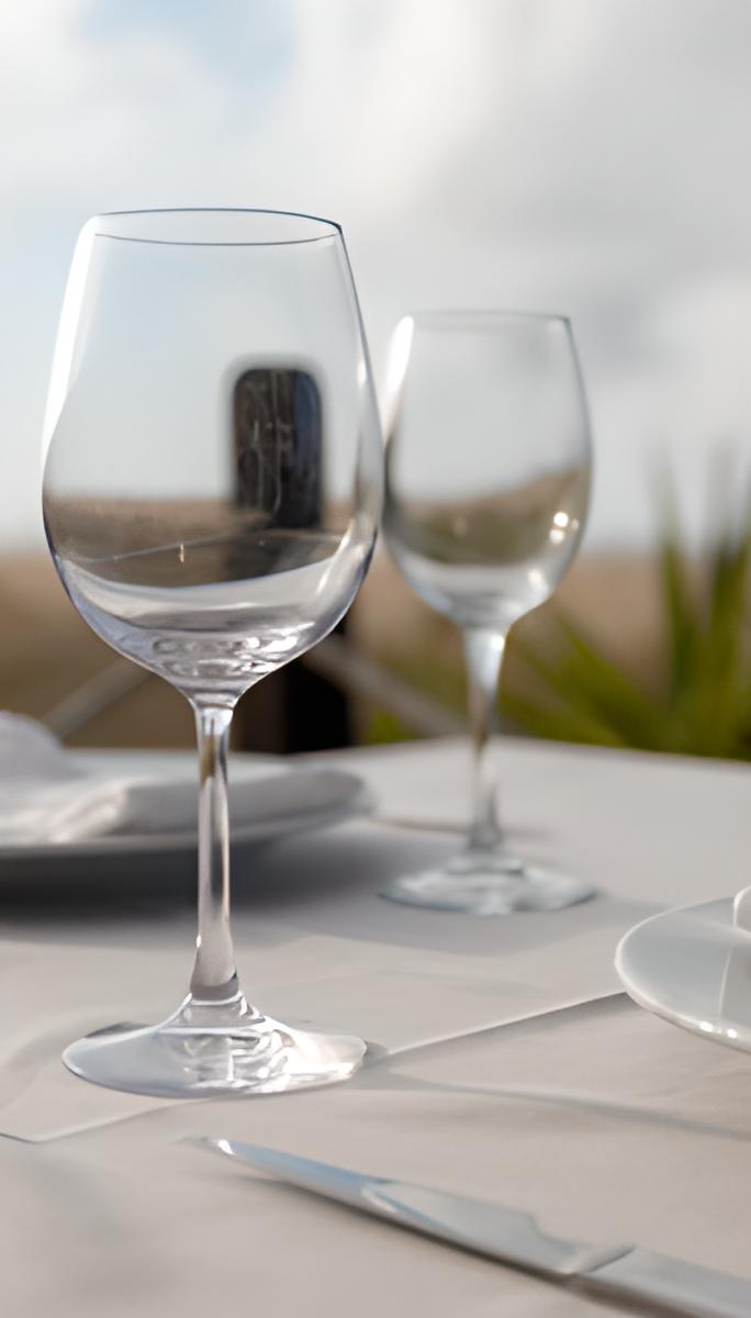 Wine glasses by the sea